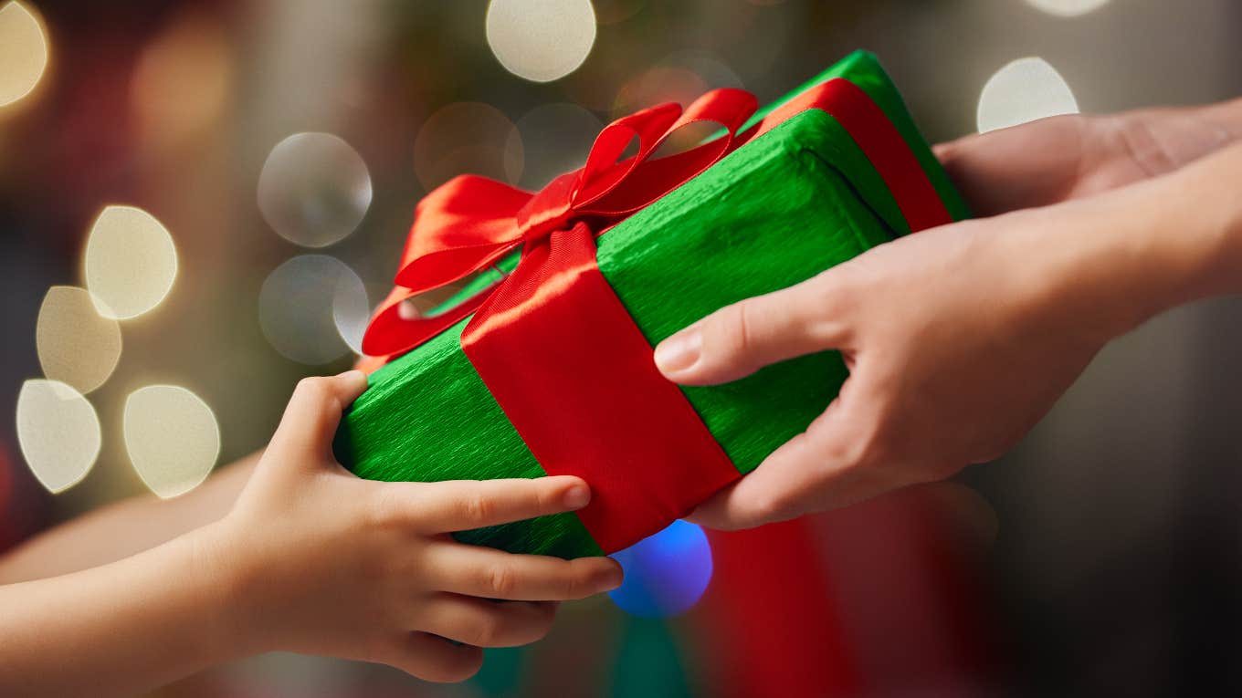 Woman Sees A Mom In Target Who Couldn't Afford To Buy A Toy For Her Son And Makes Christmas Come Early For Them Child getting Christmas gift