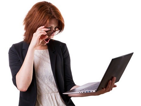woman looking at computer woman looking at computer