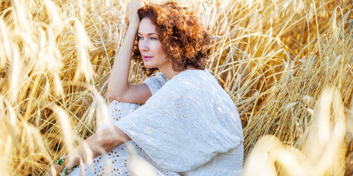 Woman sitting in field