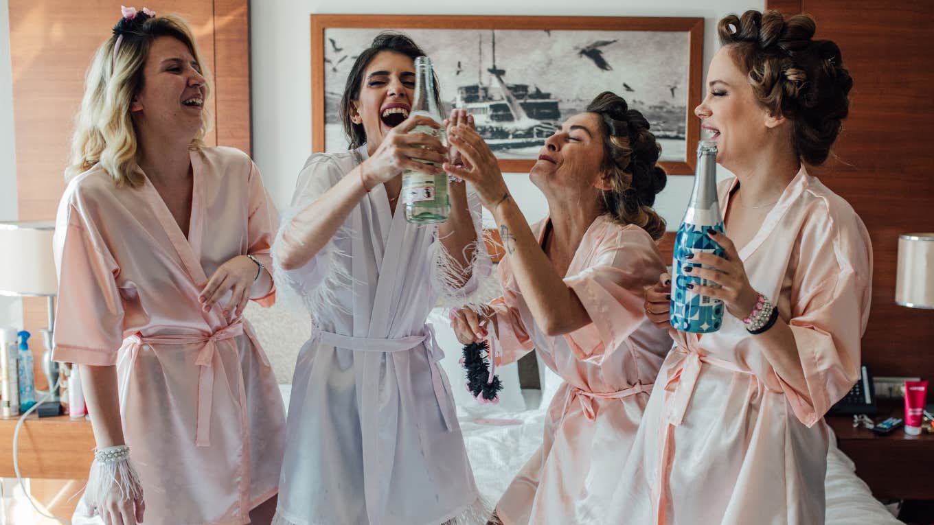 Women having champagne and laughing at a party