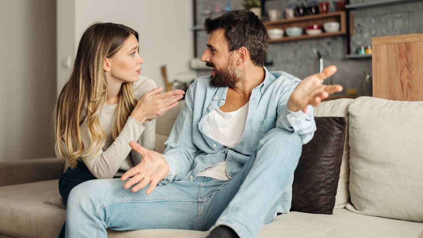 Boyfriend and girlfriend arguing on the couch