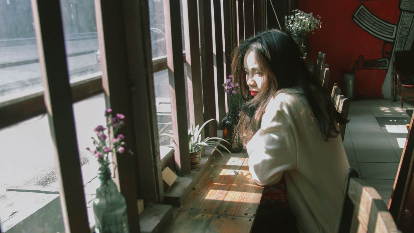 woman sitting alone at cafe