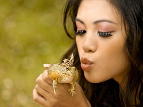 woman kissing frog