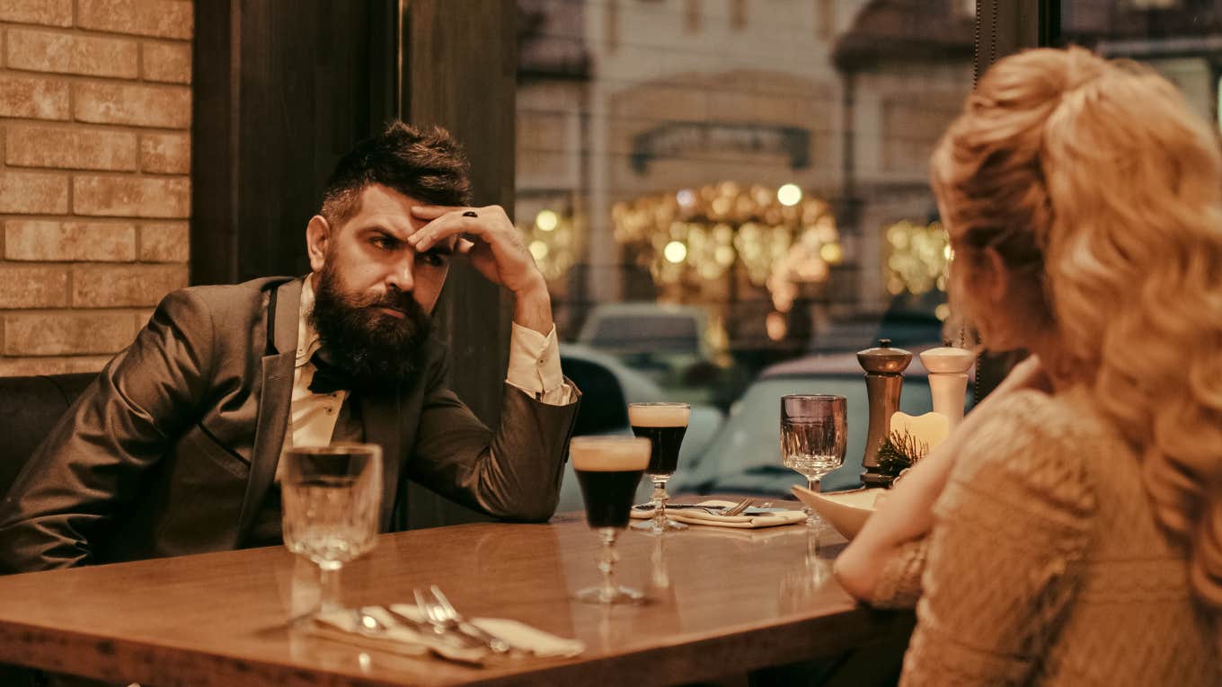 man embarrassed at dinner