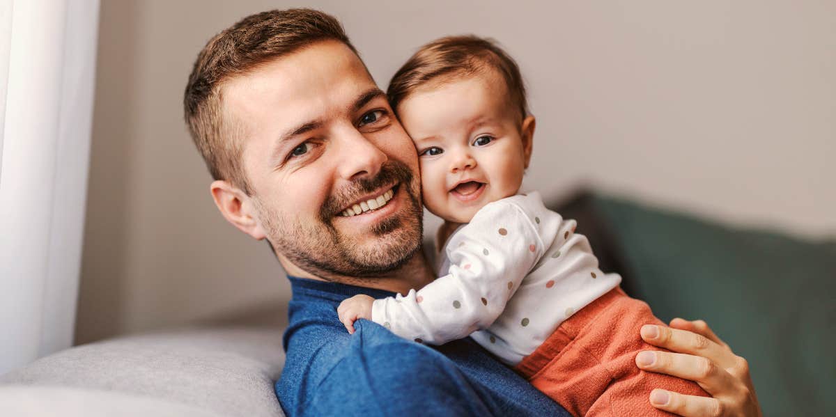 Man with his baby daughter