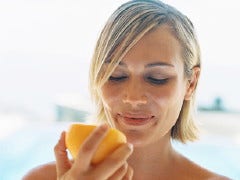 How To Make Guys Want You woman eating an orange