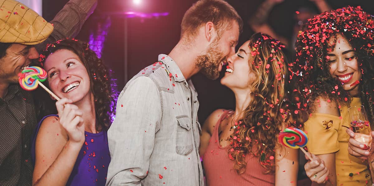 Experts Reveal The 3 Rare Personality Traits That Always Make Men Swoon man kissing woman's forehead