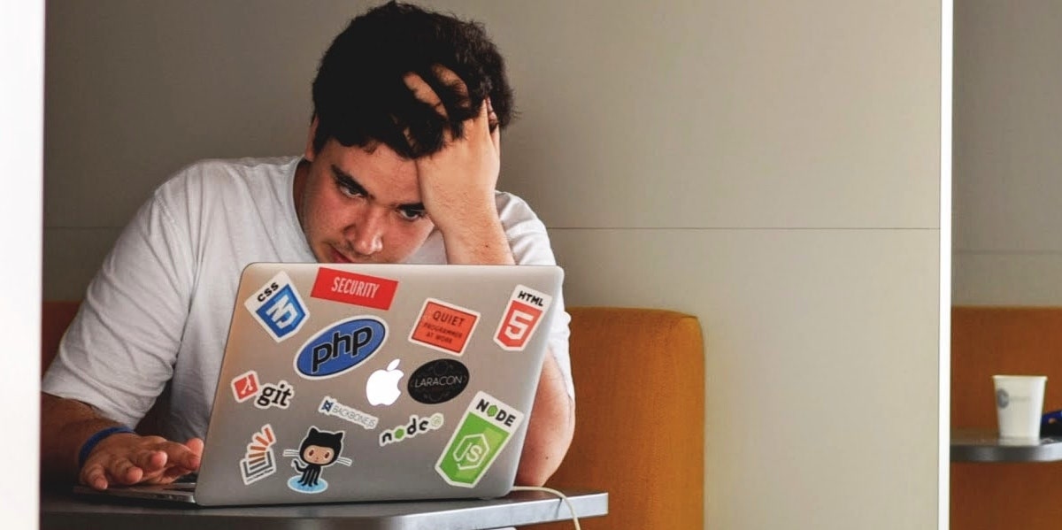 Why It's Time For The US To Switch To A 4 Day Work Week man feeling like a slave to his job