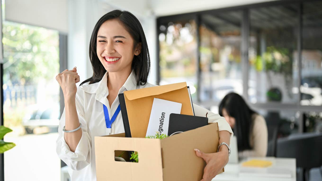 office worker is celebrating her resignation and carrying her personal stuff