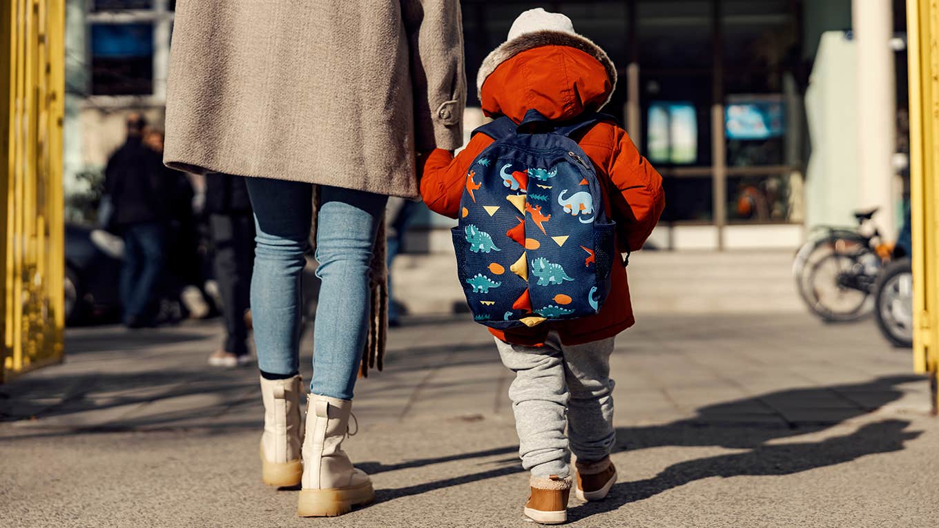 working mom walking her child to daycare