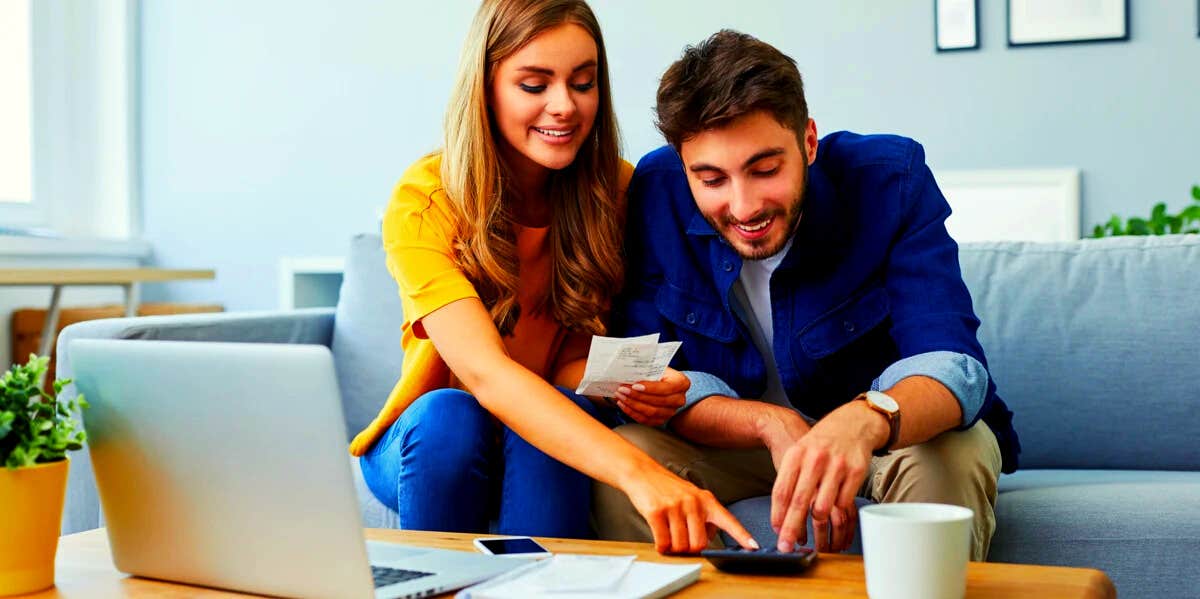 couple sitting on couch working together