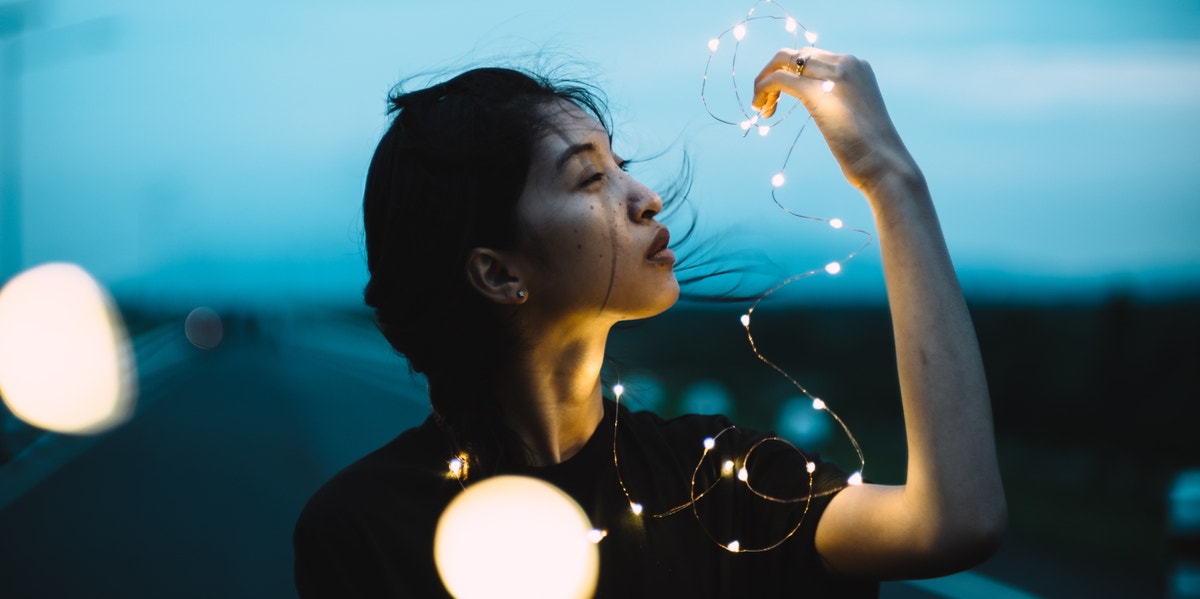 woman with fairy lights