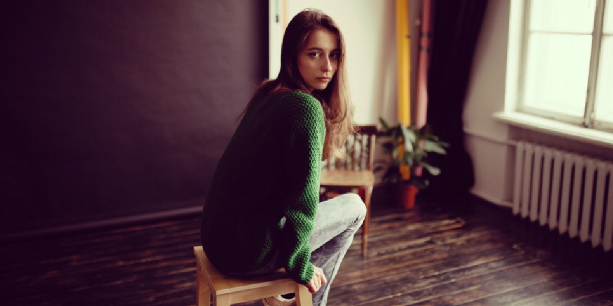 woman sitting alone in room