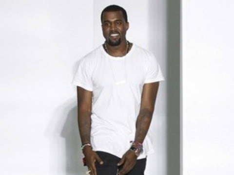 Kanye West at fashion week in white shirt 