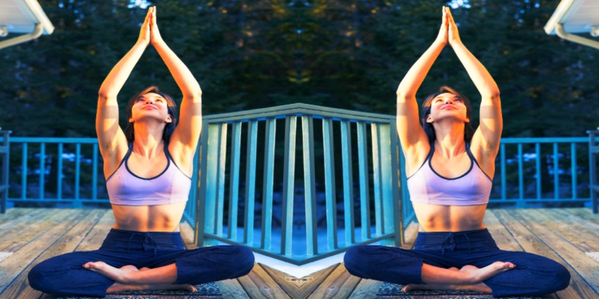 woman in yoga pose on deck