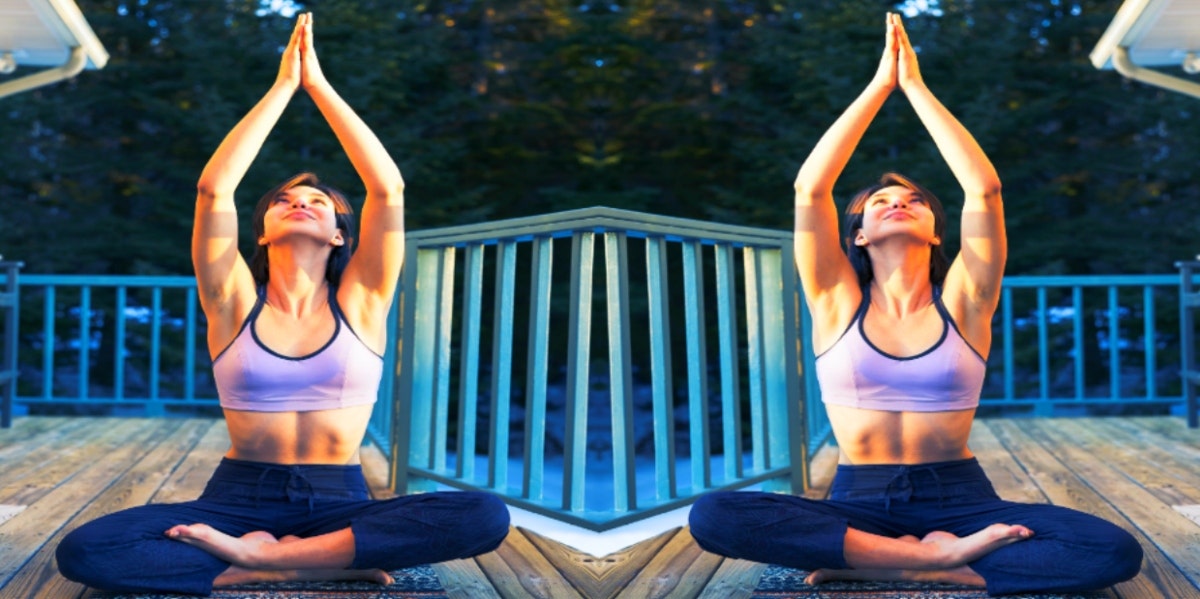 woman in yoga pose on deck