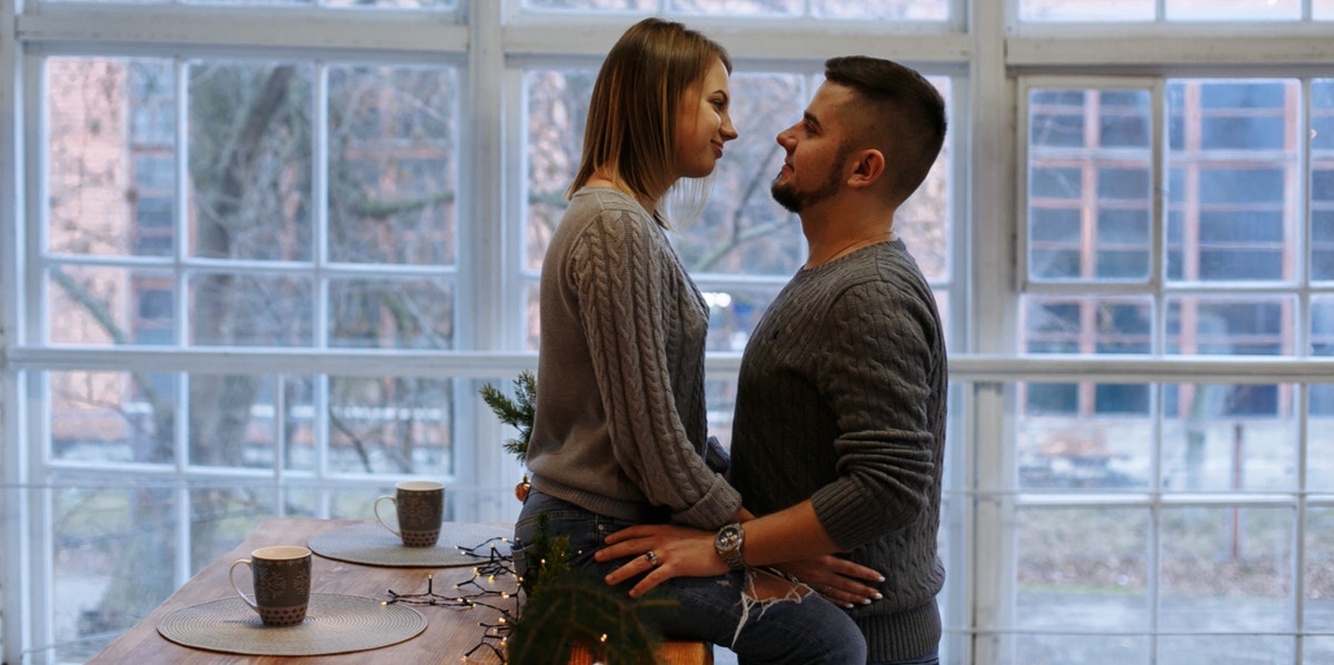 man and woman hugging