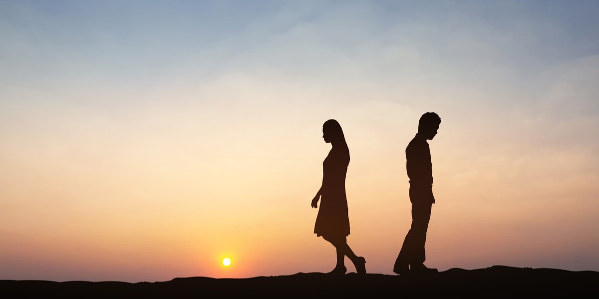 couple breaking up at sunset