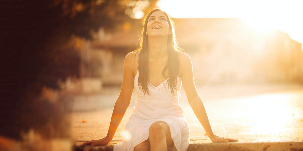 woman bathed in sunset