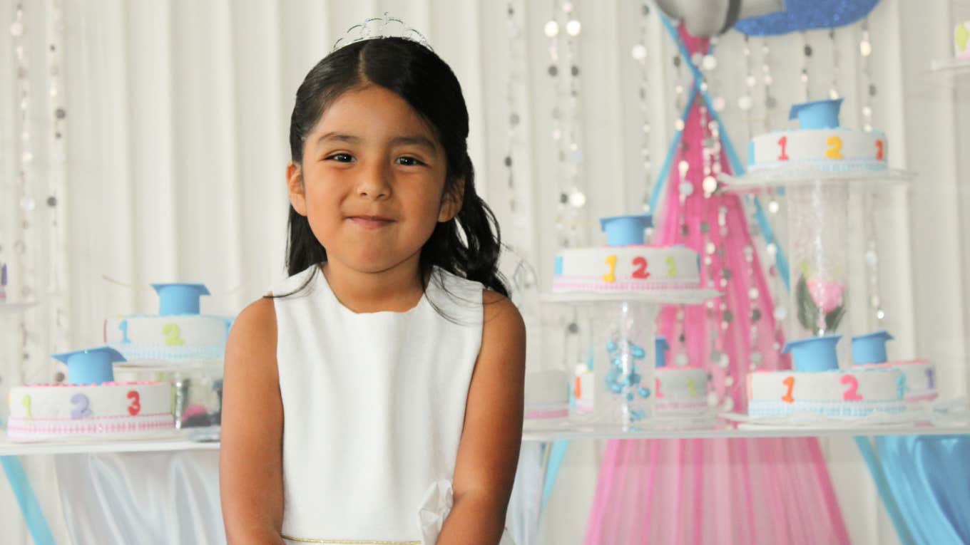 Little girl smiling at her birthday party. 