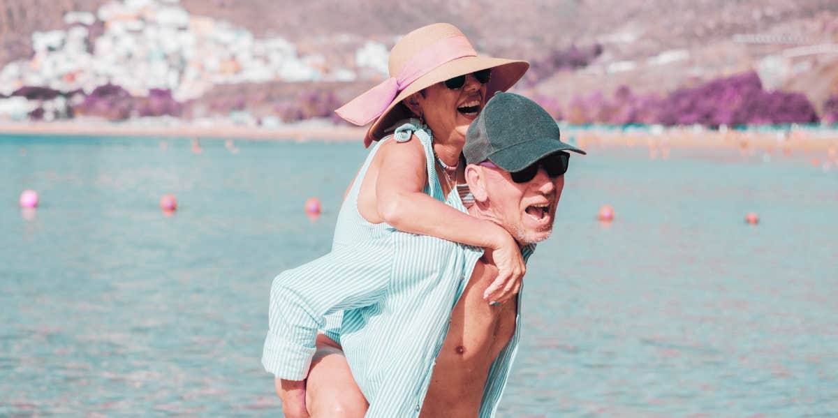 fun old couple at the beach