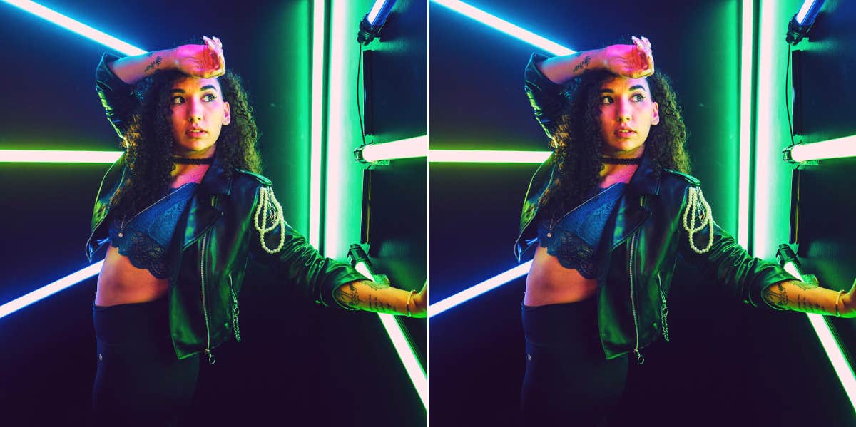 What Your Enneagram Number Says About How You Fall In Love woman posing with neon lights