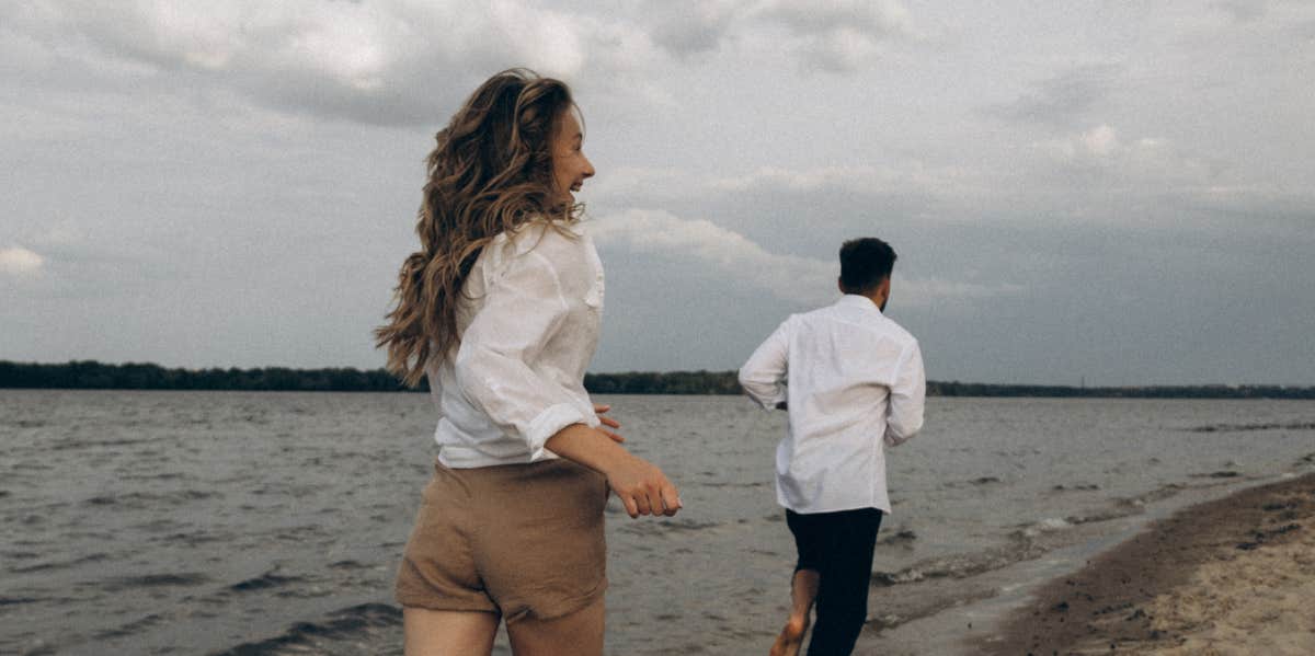 couple running on the beach