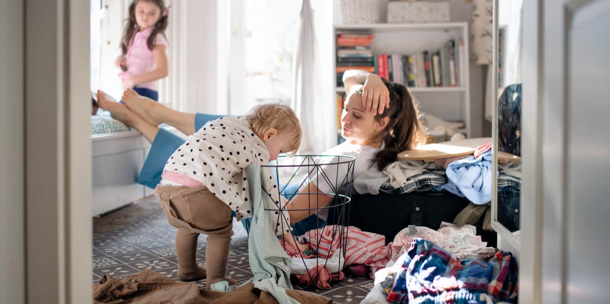 mom and children in messy room
