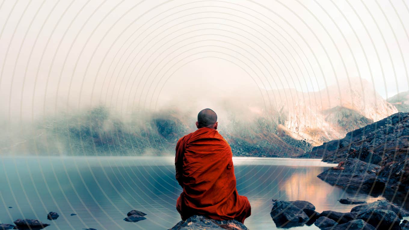 Monk sitting on rock teaching calm, focus and presence