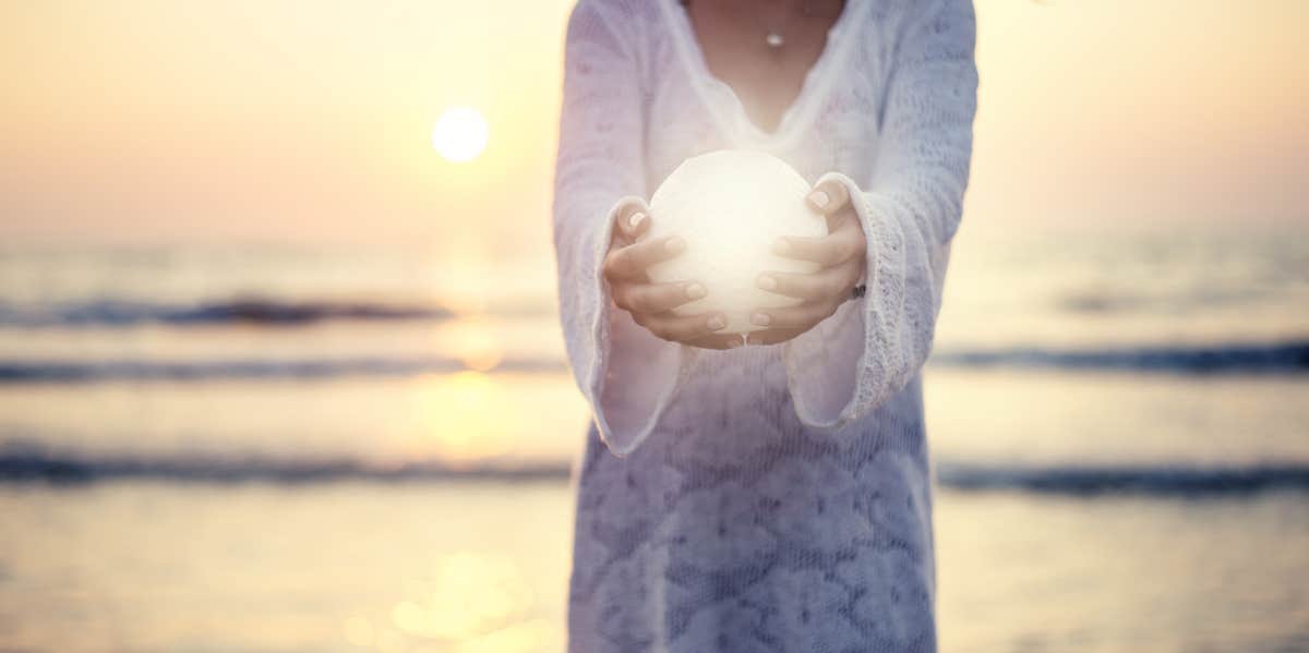 woman holding a moon