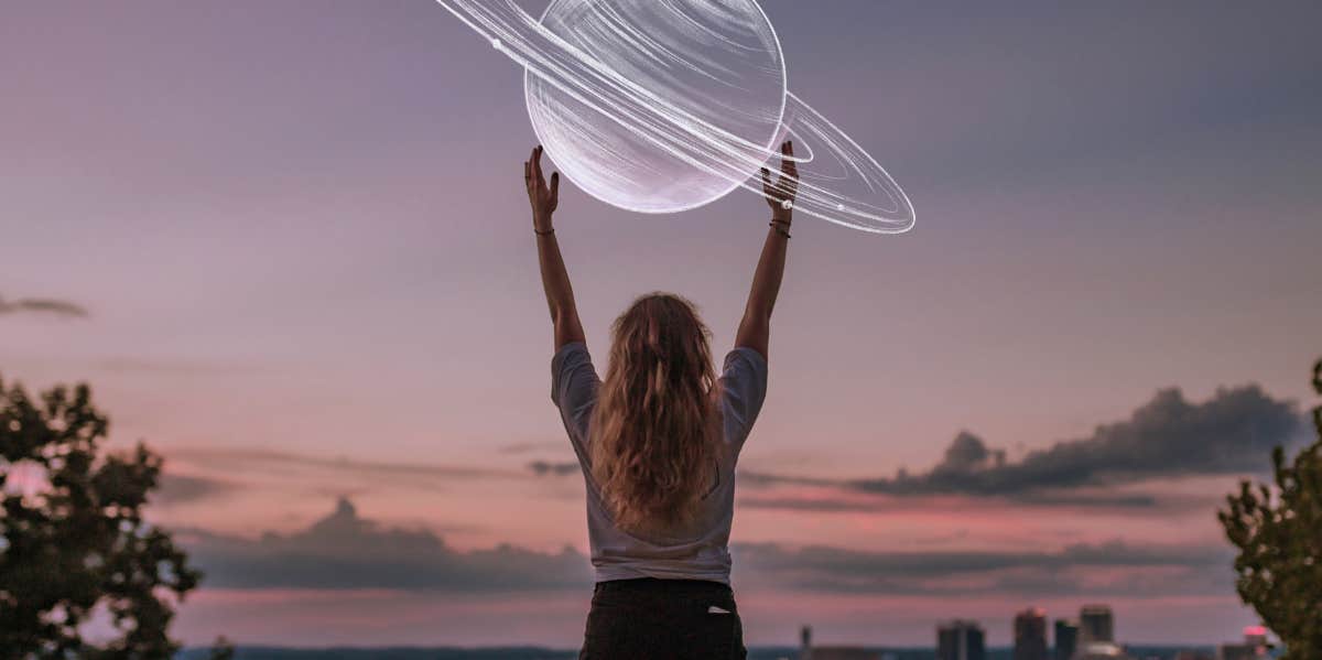 woman holding saturn