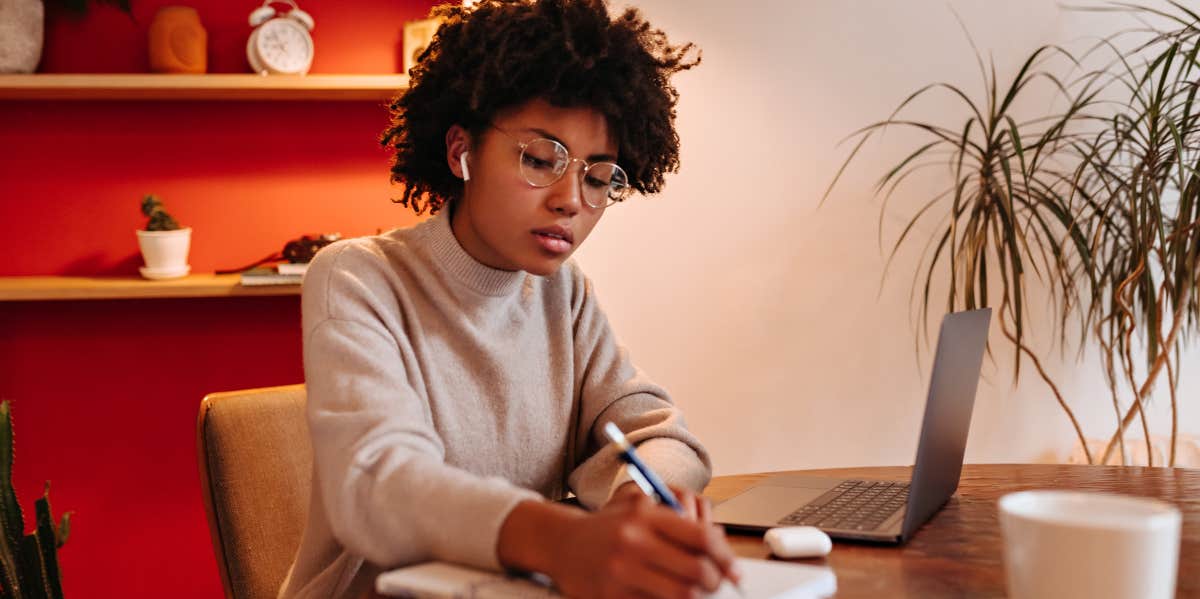 woman writing in journal