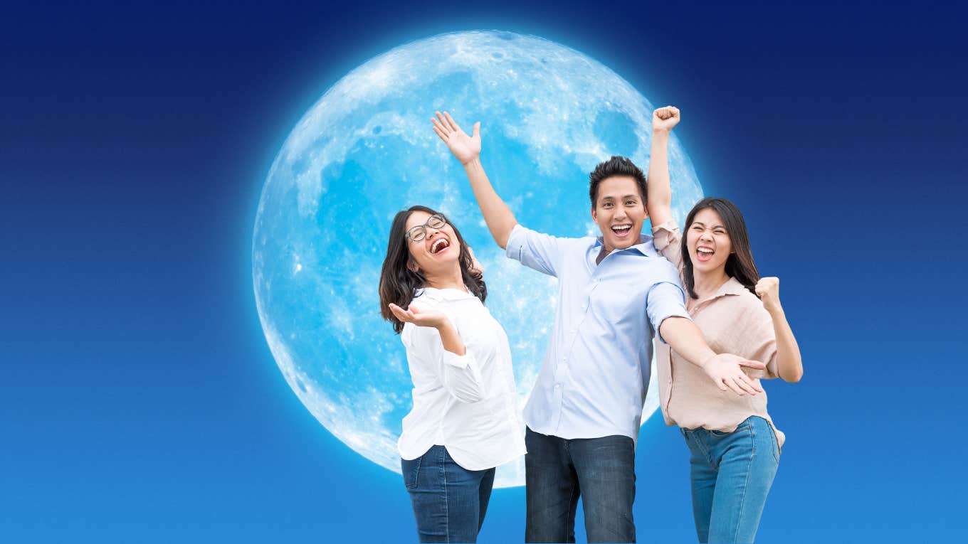 friends happy in front of a full moon