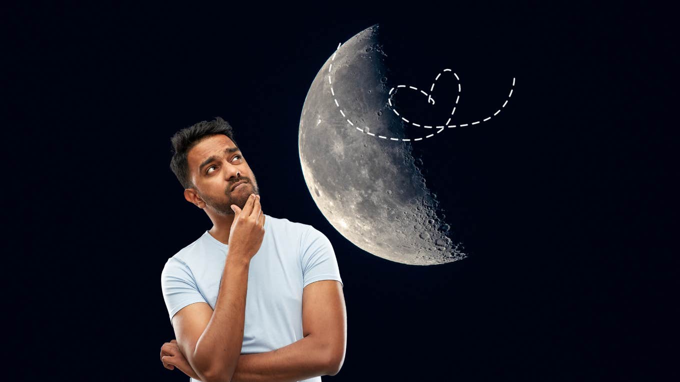 man looking at the moon