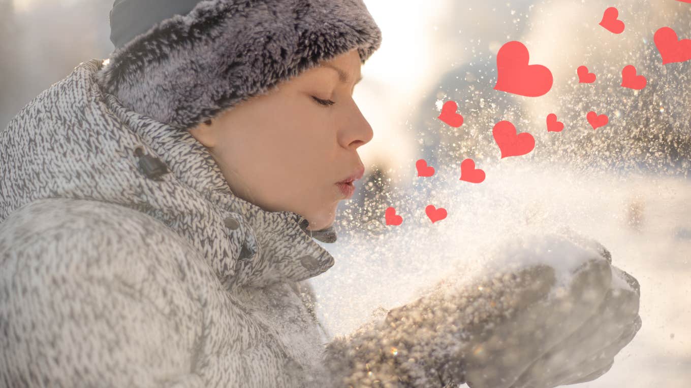 cold woman blowing hearts