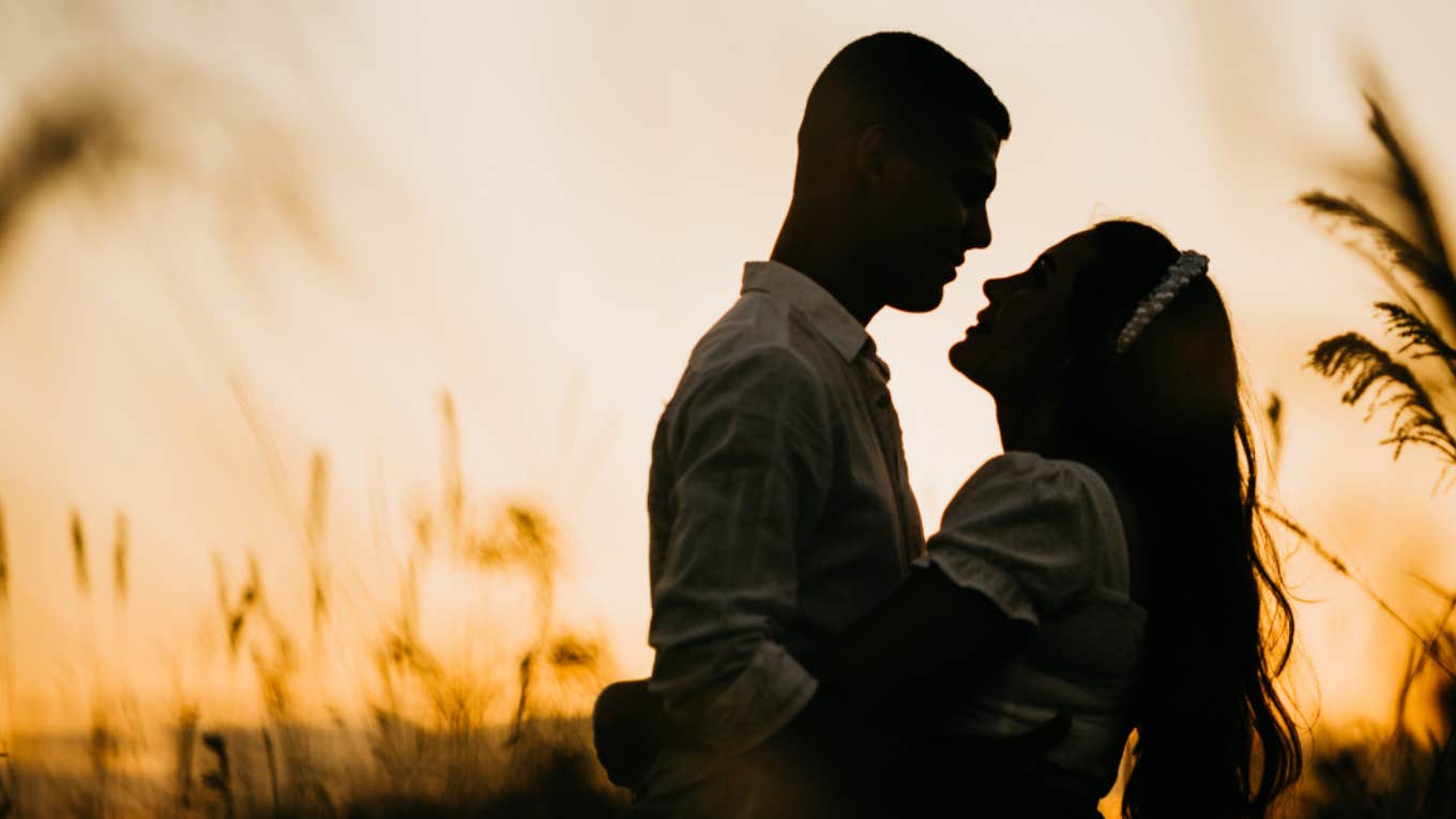 soulmates in front of a sunset