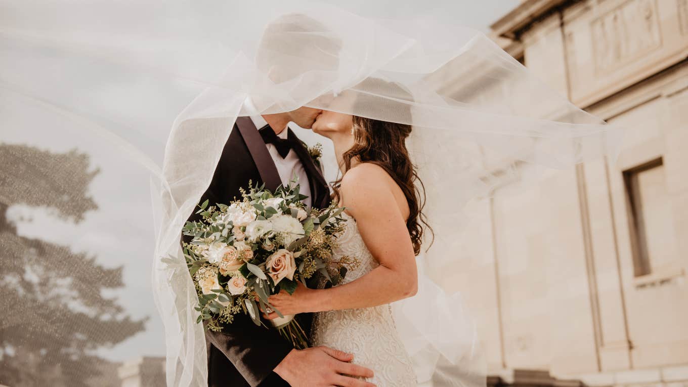 3 Zodiac Signs Who Are The Luckiest In Love On October 1, 2023 man and woman kissing on their wedding day