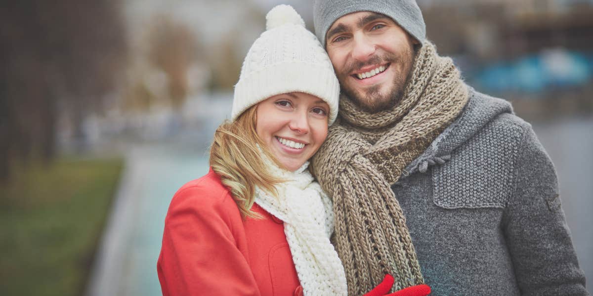 man and woman smiling happily with each other