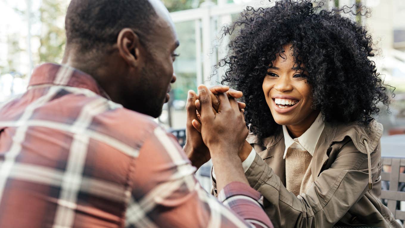 3 Specific Zodiac Signs Most Likely To Be The Luckiest In Love On September 26, 2023 couple holding hands on a table