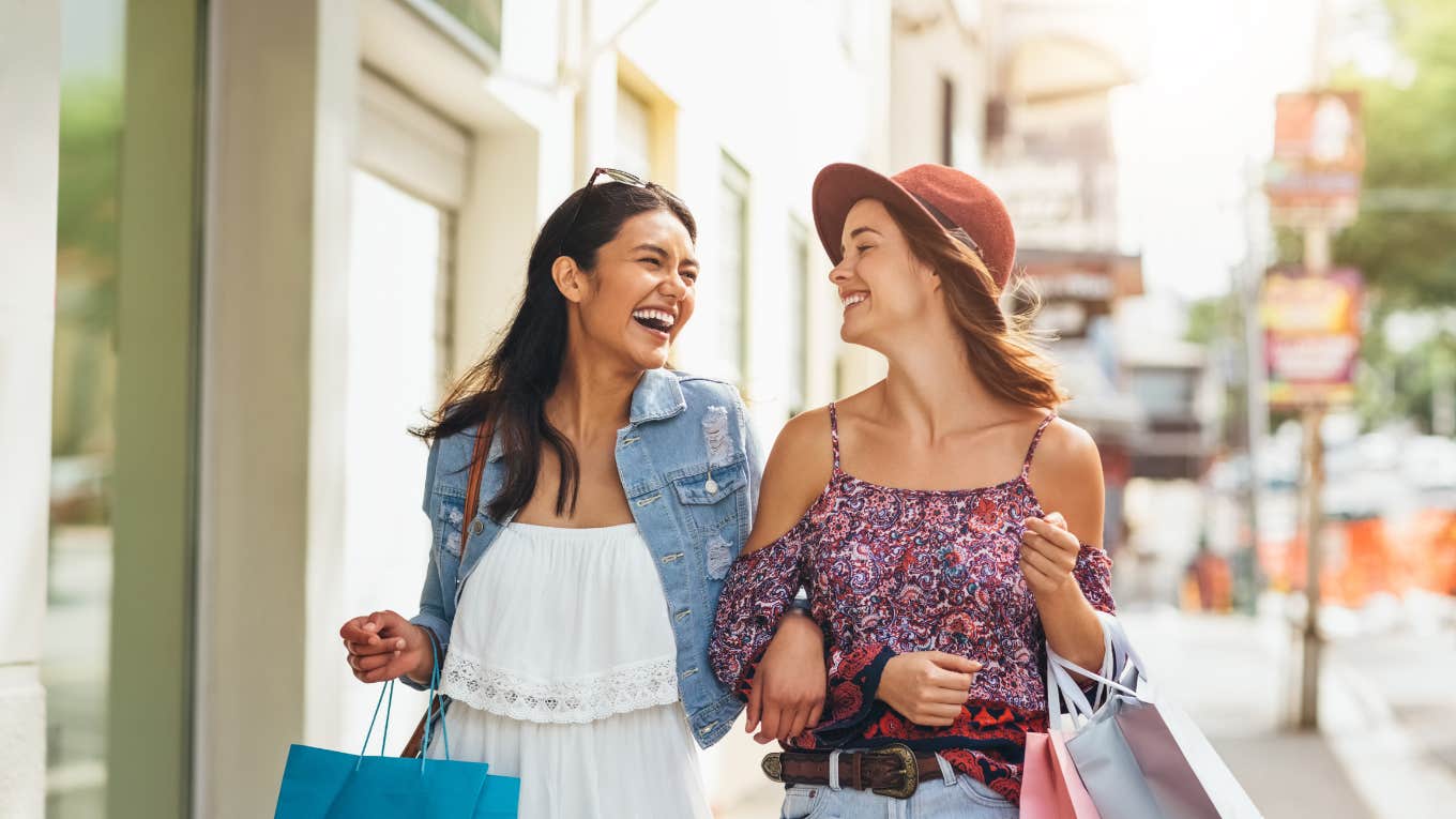 happy people walking while shopping