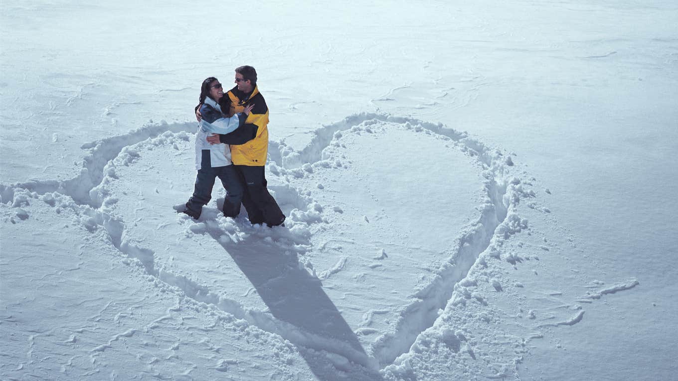 couple standing in a heart