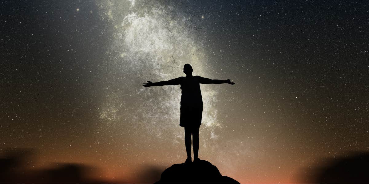 What Each Zodiac Sign Can Manifest During The Moon In Leo woman standing outside manifesting