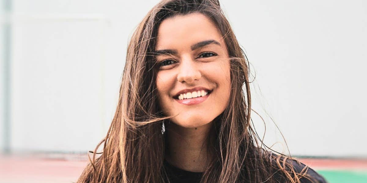 woman with brown hair smiling