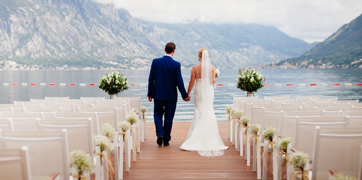 bride and groom at wedding with mountainous background