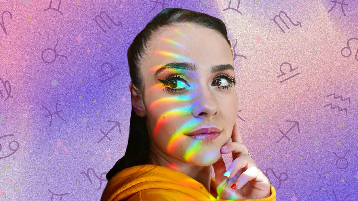 woman with rainbow reflection on her face
