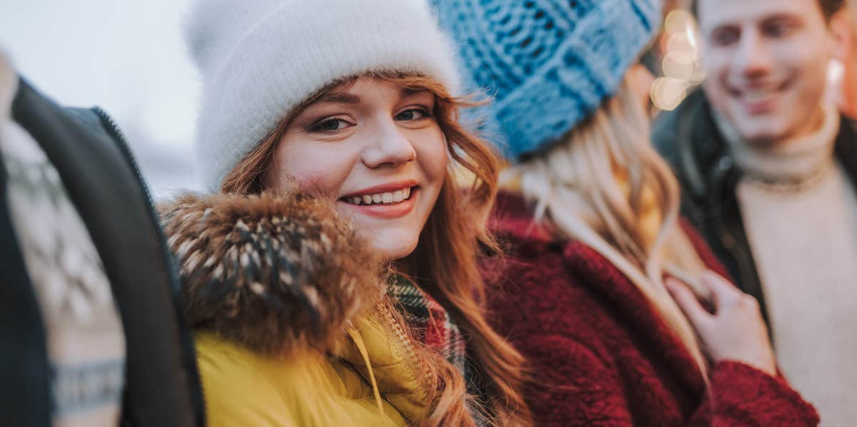 woman wearing white snow hat