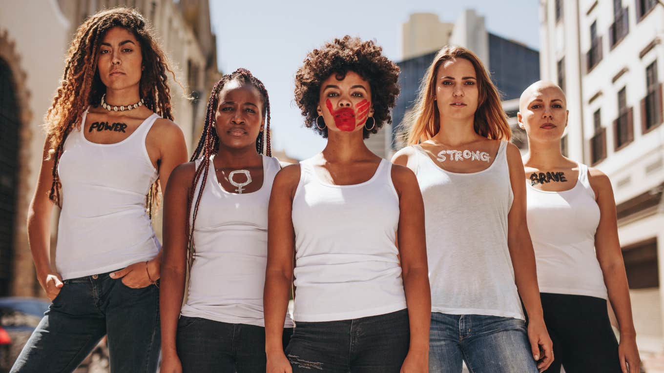 group of powerful women with face and body paint