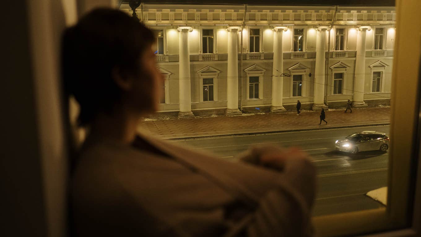 woman looking outside
