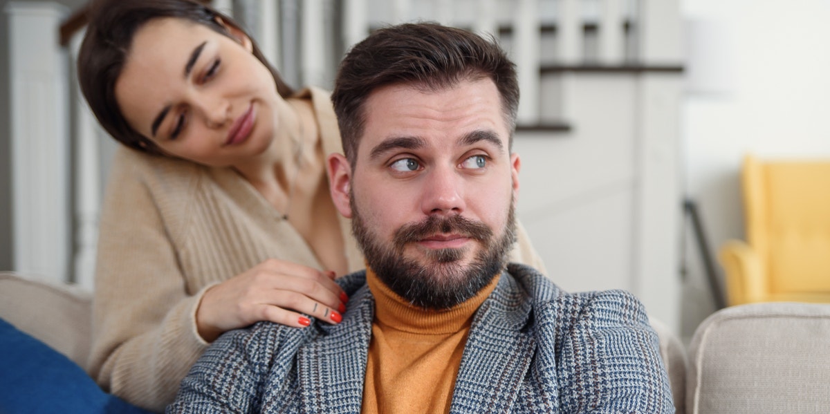 woman asking man for forgiveness