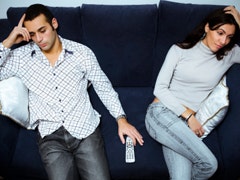 unhappy couple on couch